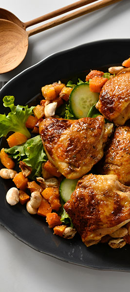 Oven roasted thighs served on a bed of Pumpkin and Roasted Beans 